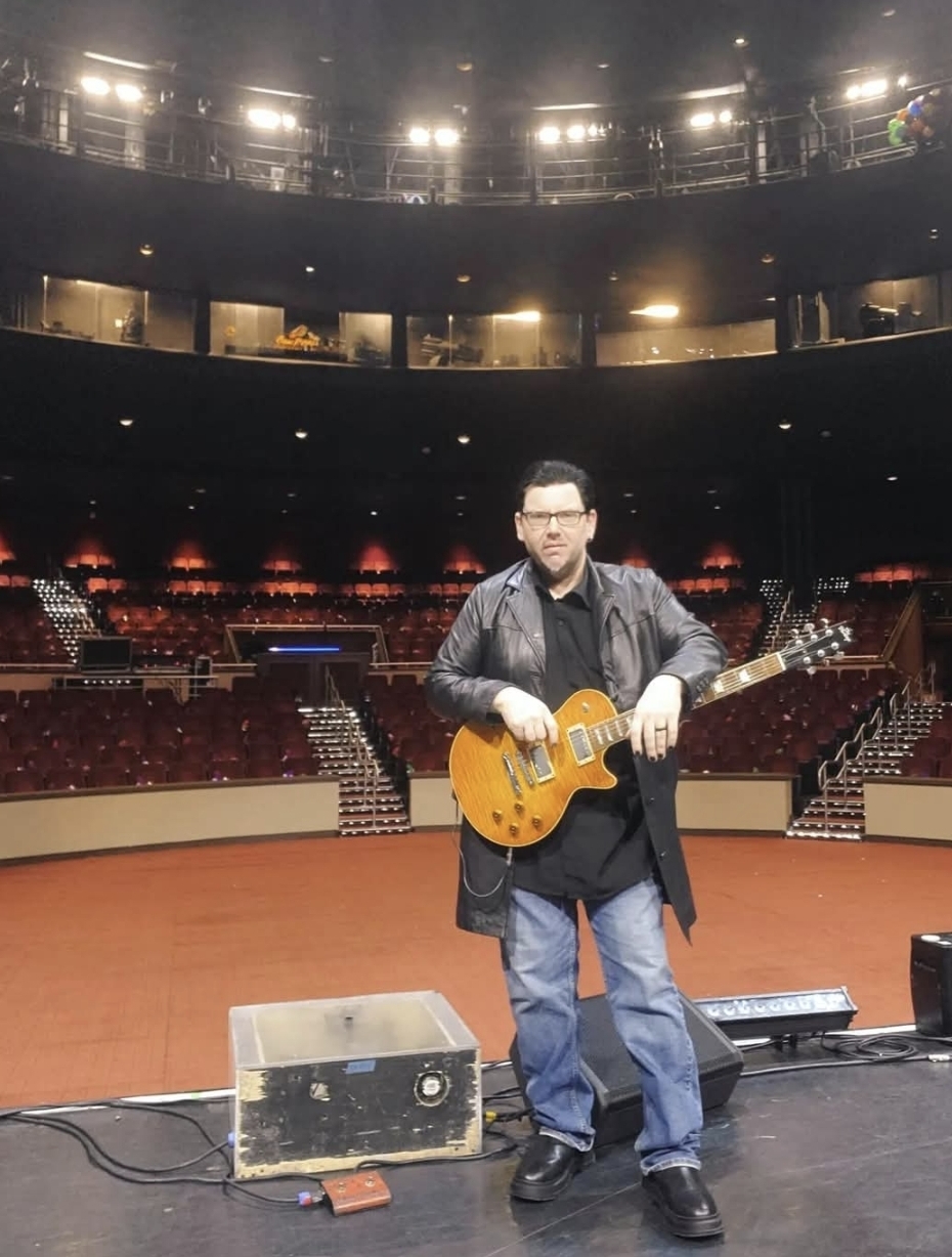 Jack Miele playing Les Paul on an arena stage