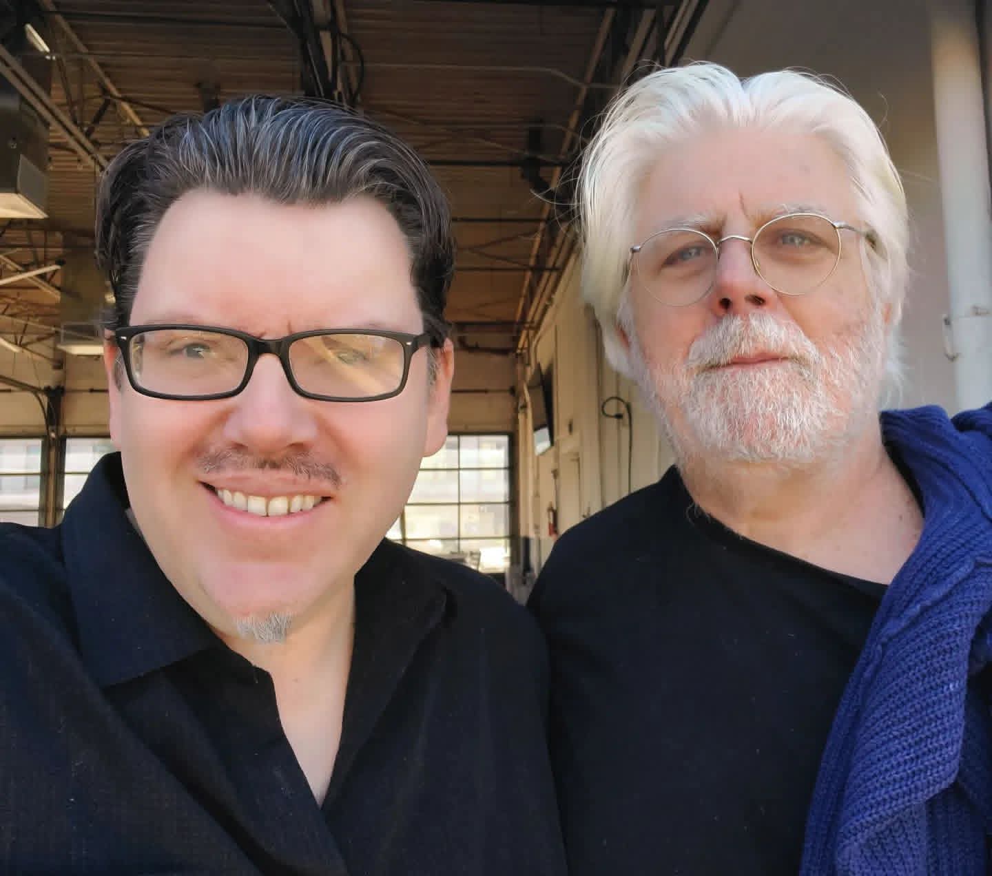 Jack Miele in a selfie with a white-haired, bearded man